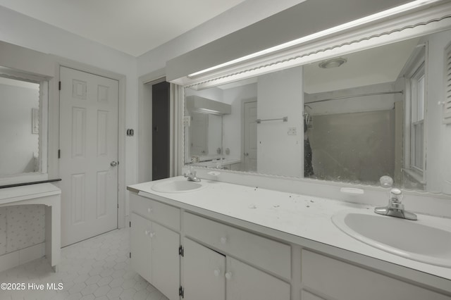 full bathroom featuring double vanity and tile patterned floors