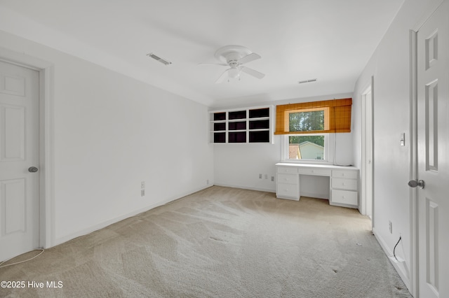 unfurnished bedroom featuring carpet, a ceiling fan, and baseboards