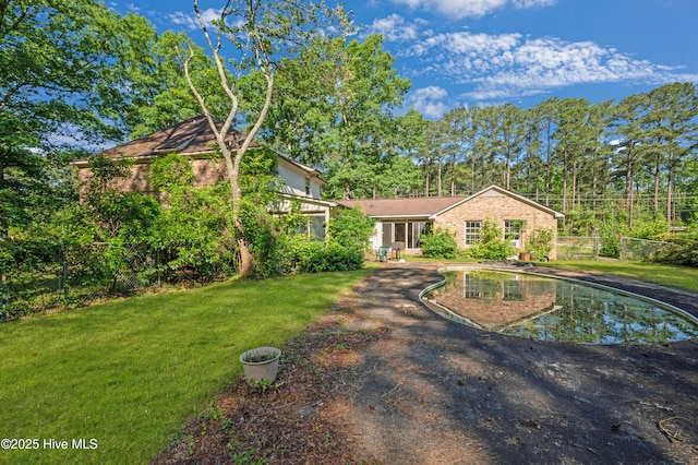 view of front of home with a front yard