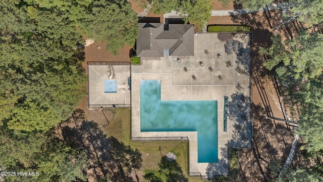 view of subject property featuring a pool area