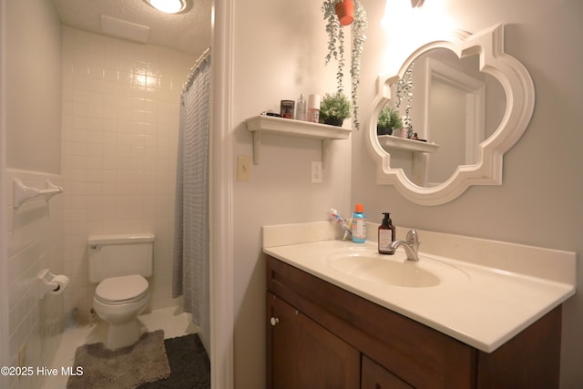 full bath with toilet and vanity