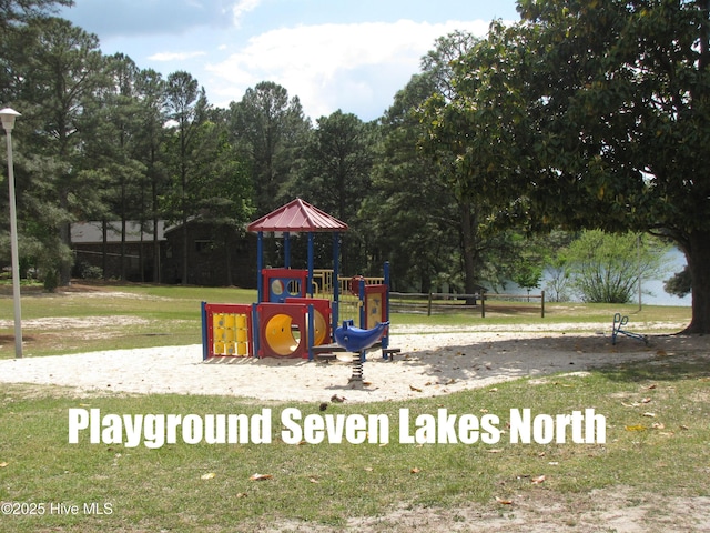 communal playground featuring a lawn