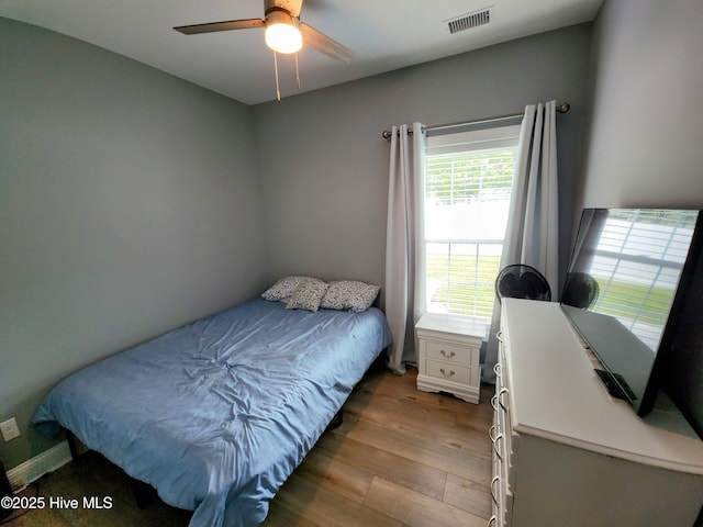 bedroom featuring wood finished floors and a ceiling fan