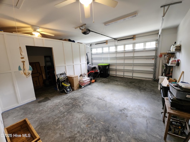 garage with ceiling fan and a garage door opener