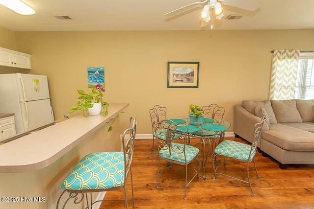 139 Avian Dr Unit 3614, Sunset Beach, NC 28468 - dining area with wood finished floors, a ceiling fan, and baseboards