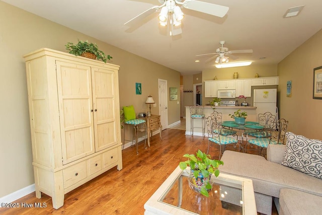 139 Avian Dr Unit 3614, Sunset Beach, NC 28468 - living area featuring a ceiling fan, light wood-type flooring, and baseboards