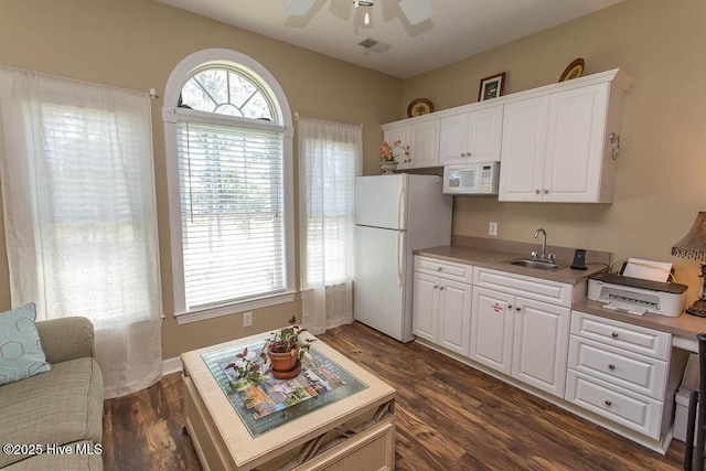 139 Avian Dr Unit 3614, Sunset Beach, NC 28468 - kitchen featuring white appliances, a sink, white cabinets, a ceiling fan, and light countertops