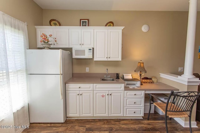 139 Avian Dr Unit 3614, Sunset Beach, NC 28468 - kitchen with white appliances, a sink, decorative columns, white cabinetry, and light countertops