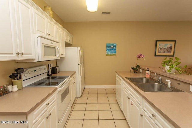139 Avian Dr Unit 3614, Sunset Beach, NC 28468 - kitchen with white appliances, a sink, white cabinetry, light tile patterned floors, and baseboards