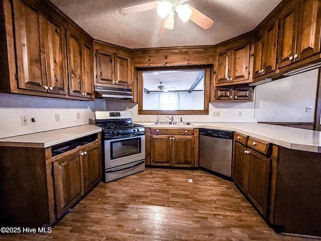 434 Farless Rd, Merry Hill, NC 27957 - kitchen with stainless steel appliances, under cabinet range hood, a ceiling fan, a textured ceiling, and a sink