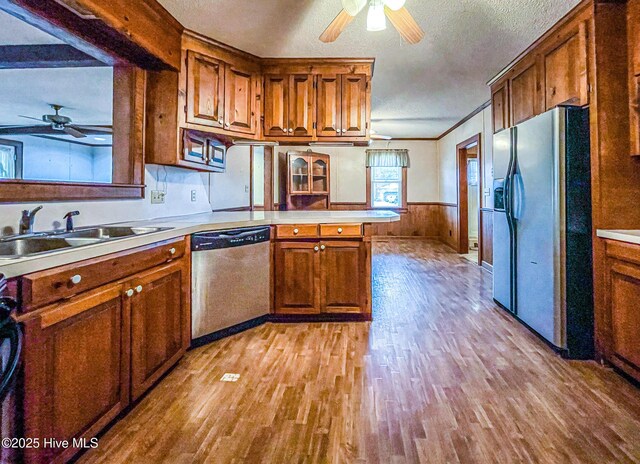 434 Farless Rd, Merry Hill, NC 27957 - kitchen with stainless steel appliances, ceiling fan, a sink, a peninsula, and light wood-style floors