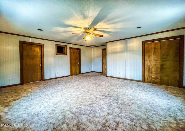 434 Farless Rd, Merry Hill, NC 27957 - unfurnished bedroom with two closets, crown molding, carpet, a ceiling fan, and baseboards