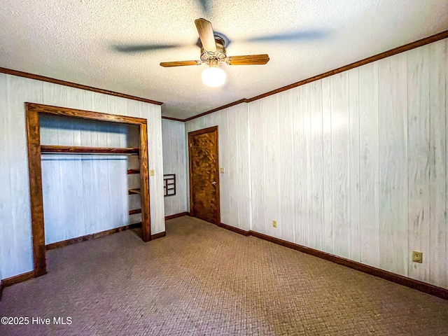 434 Farless Rd, Merry Hill, NC 27957 - unfurnished bedroom with crown molding, a textured ceiling, a closet, carpet floors, and a ceiling fan