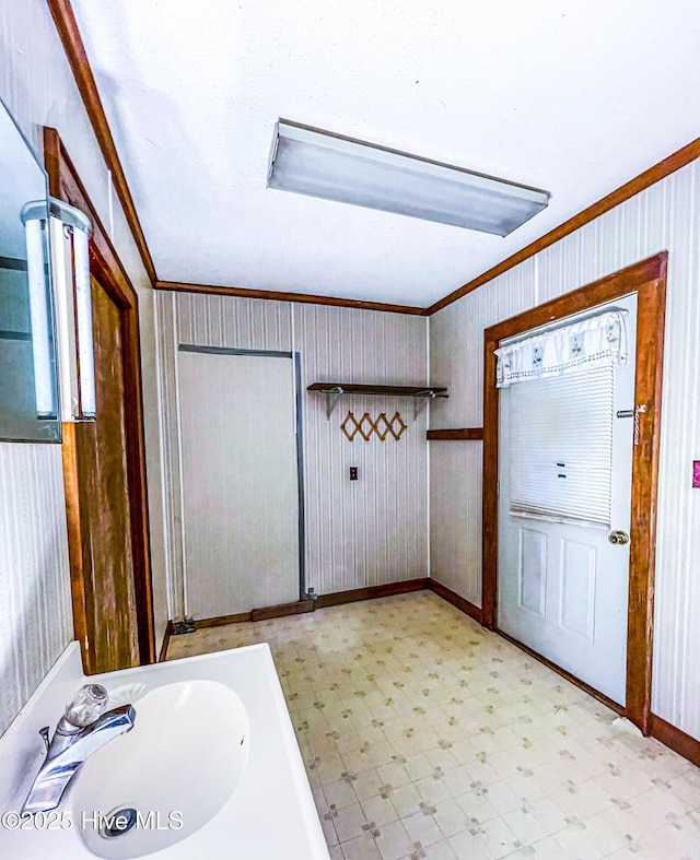 434 Farless Rd, Merry Hill, NC 27957 - bathroom with crown molding, tile patterned floors, baseboards, a sink, and wooden walls