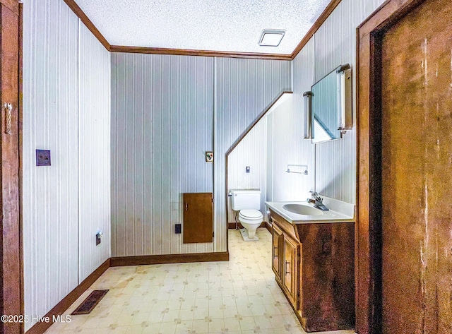 434 Farless Rd, Merry Hill, NC 27957 - bathroom featuring ornamental molding, tile patterned floors, toilet, vanity, and baseboards