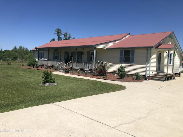 434 Farless Rd, Merry Hill, NC 27957 - ranch-style home featuring a porch, metal roof, a front lawn, and driveway