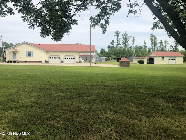 434 Farless Rd, Merry Hill, NC 27957 - view of green lawn with a garage