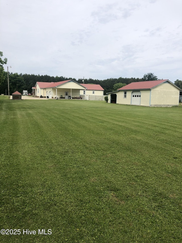 434 Farless Rd, Merry Hill, NC 27957 - view of green lawn with an outbuilding and a detached garage