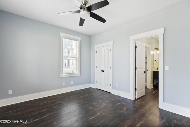 unfurnished bedroom with dark wood-style flooring, baseboards, a closet, and a ceiling fan