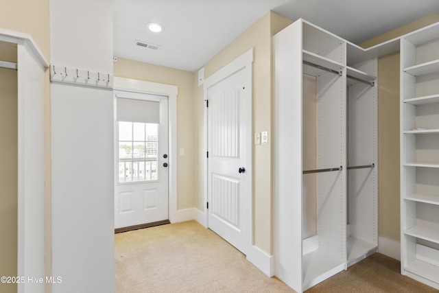 spacious closet featuring carpet