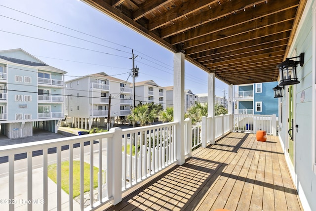 wooden terrace with a residential view