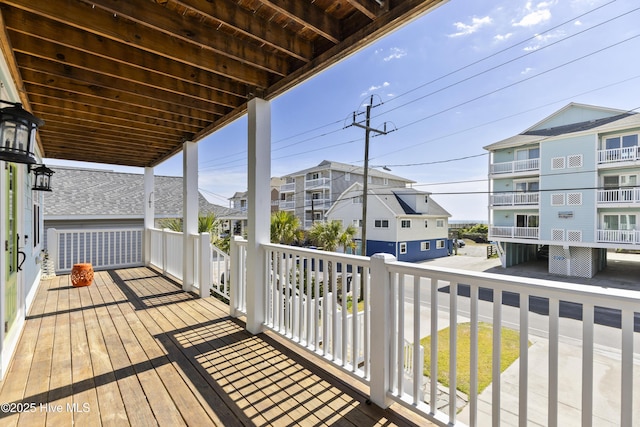 wooden deck with a residential view