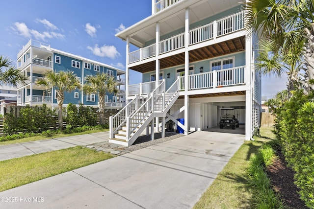 view of property featuring a carport and driveway