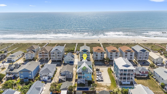 aerial view of residential area featuring unending shoreline