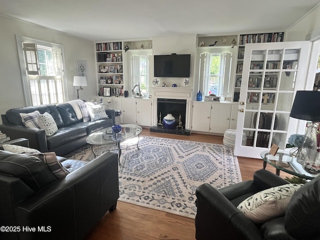 310 N Franklin St, Whiteville, NC 28472 - living room with wood finished floors and a fireplace with raised hearth
