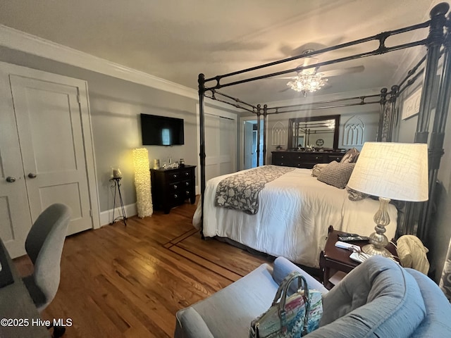 310 N Franklin St, Whiteville, NC 28472 - bedroom featuring ornamental molding, wood finished floors, and baseboards