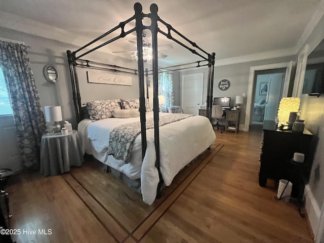 310 N Franklin St, Whiteville, NC 28472 - bedroom with wood finished floors, crown molding, and a ceiling fan