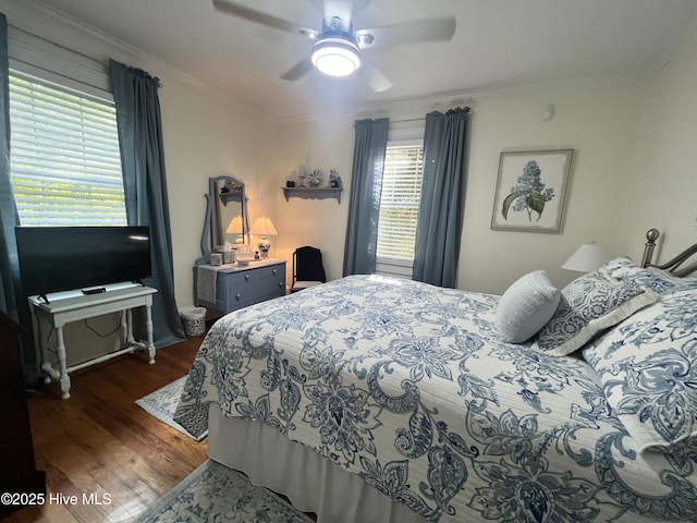 310 N Franklin St, Whiteville, NC 28472 - bedroom with dark wood-style flooring, crown molding, and ceiling fan