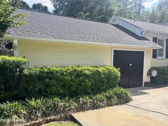 310 N Franklin St, Whiteville, NC 28472 - view of home's exterior with a shingled roof, an attached garage, and concrete driveway