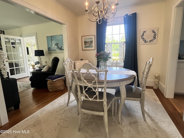 310 N Franklin St, Whiteville, NC 28472 - dining space featuring a chandelier, crown molding, wood finished floors, and baseboards