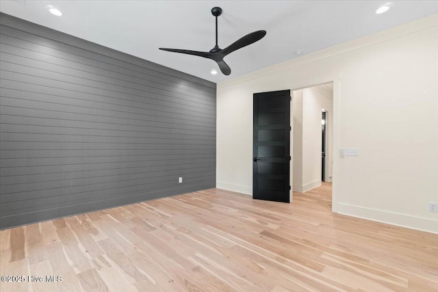 spare room with ceiling fan, baseboards, light wood finished floors, and recessed lighting