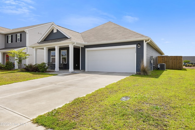 3522 Wigeon Way, Winnabow, NC 28479 - view of front of home with central AC, an attached garage, driveway, and a porch