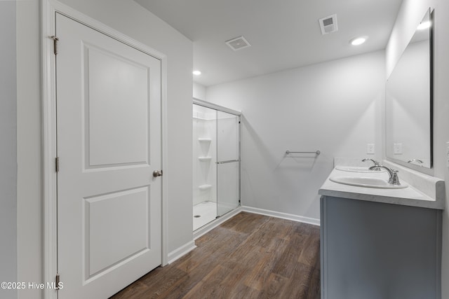3522 Wigeon Way, Winnabow, NC 28479 - full bath featuring a stall shower, baseboards, wood finished floors, double vanity, and recessed lighting