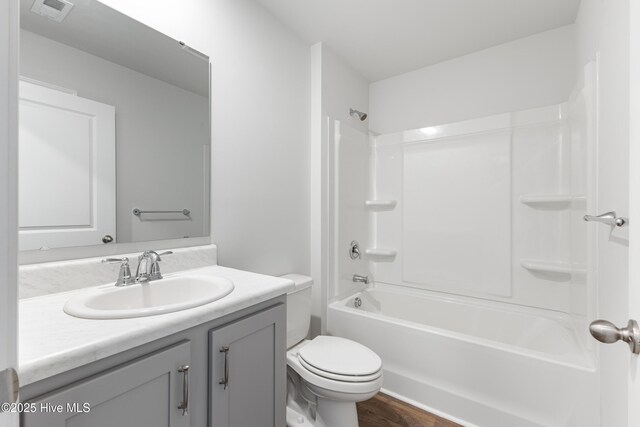 3522 Wigeon Way, Winnabow, NC 28479 - full bathroom with toilet, vanity, wood finished floors, and tub / shower combination