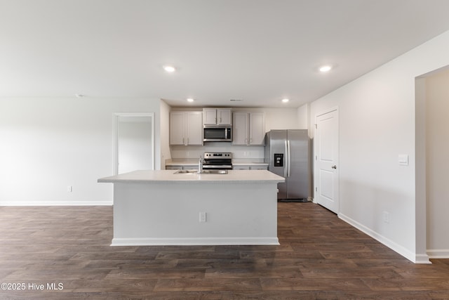 3522 Wigeon Way, Winnabow, NC 28479 - kitchen featuring appliances with stainless steel finishes, light countertops, baseboards, dark wood-type flooring, and recessed lighting