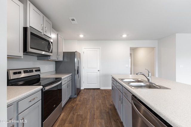 3522 Wigeon Way, Winnabow, NC 28479 - kitchen with appliances with stainless steel finishes, a sink, dark wood finished floors, light countertops, and recessed lighting