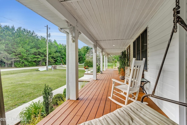 3297 Bay City Rd, Aurora, NC 27806 - wooden deck featuring a porch and a lawn