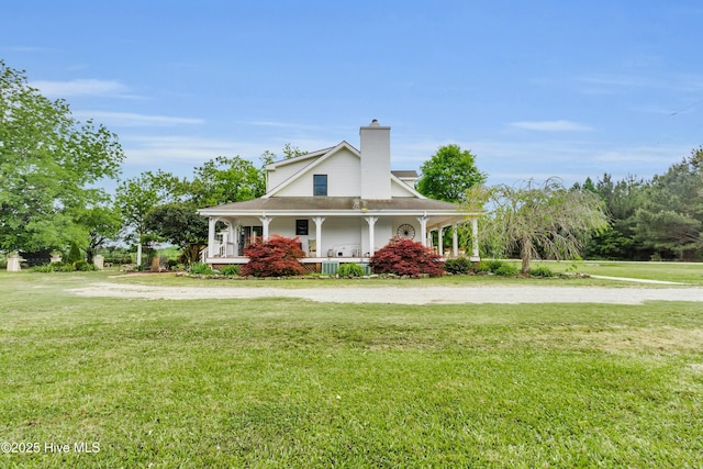 3297 Bay City Rd, Aurora, NC 27806 - farmhouse-style home featuring covered porch, a front yard, a chimney, and dirt driveway