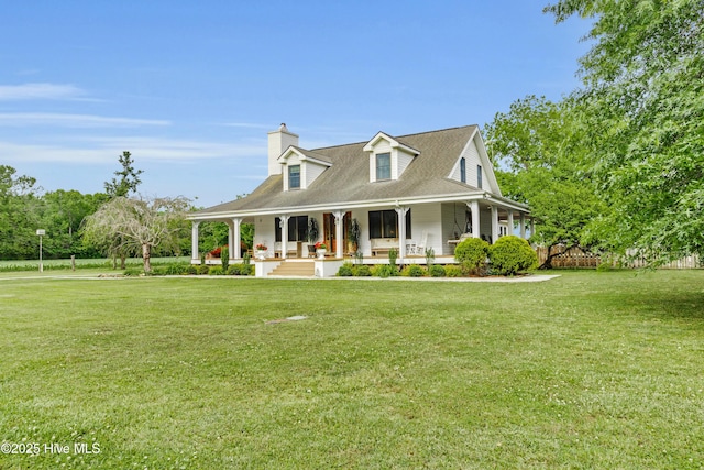 3297 Bay City Rd, Aurora, NC 27806 - country-style home featuring covered porch, a front yard, and a chimney