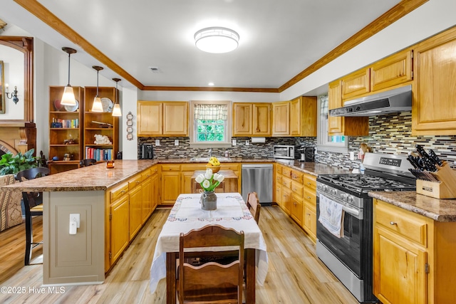 3297 Bay City Rd, Aurora, NC 27806 - kitchen featuring stainless steel appliances, under cabinet range hood, a peninsula, a kitchen bar, and light wood-type flooring