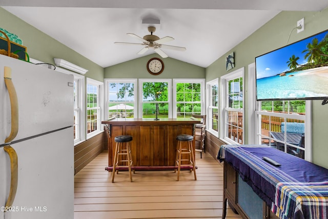 3297 Bay City Rd, Aurora, NC 27806 - sunroom / solarium with vaulted ceiling, hardwood / wood-style flooring, and bar