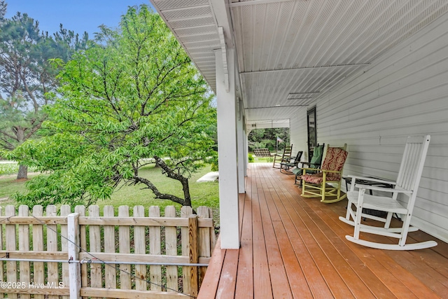 3297 Bay City Rd, Aurora, NC 27806 - wooden terrace featuring a porch and fence