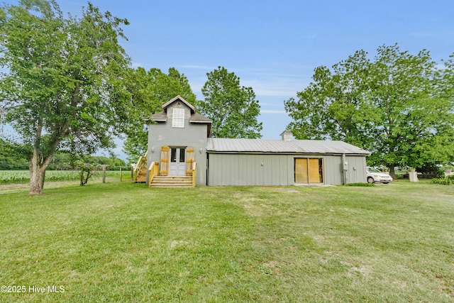 3297 Bay City Rd, Aurora, NC 27806 - back of property with a yard and a chimney