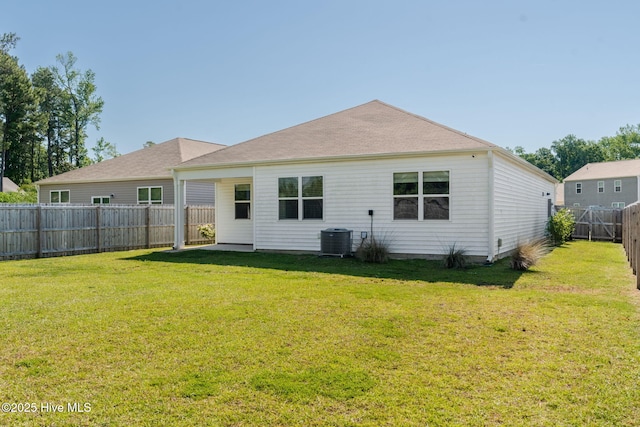 back of property with central AC