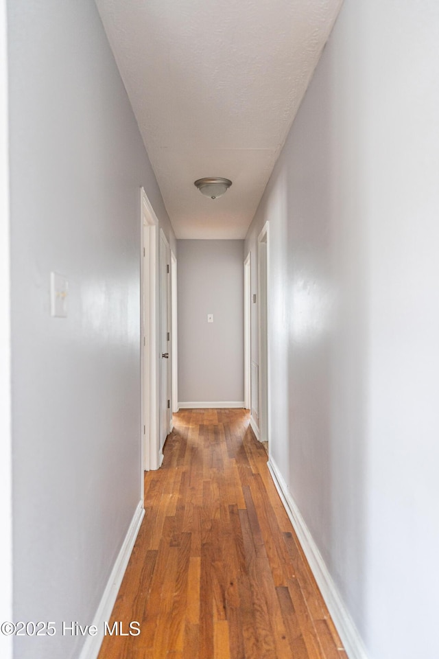 137 Pinecrest Trl, Rockingham, NC 28379 - hallway featuring light wood-style floors and baseboards