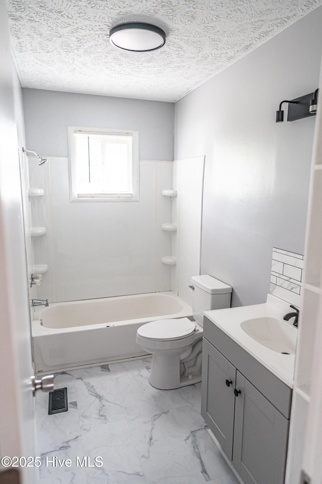 137 Pinecrest Trl, Rockingham, NC 28379 - bathroom with toilet, marble look tile flooring, shower / washtub combination, vanity, and a textured ceiling